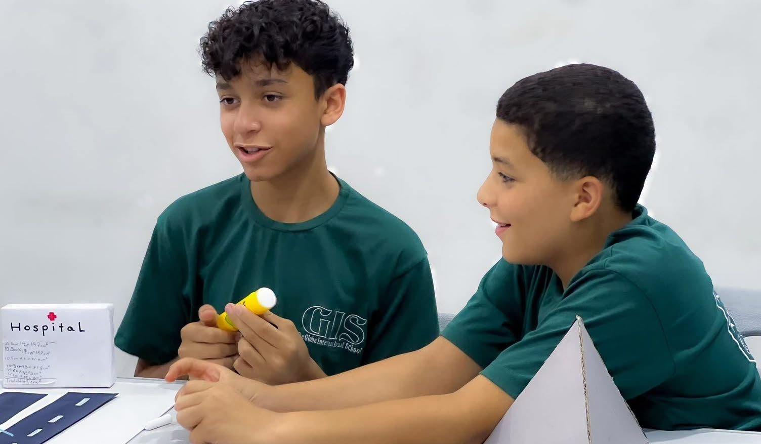 Middle school students working on a math project