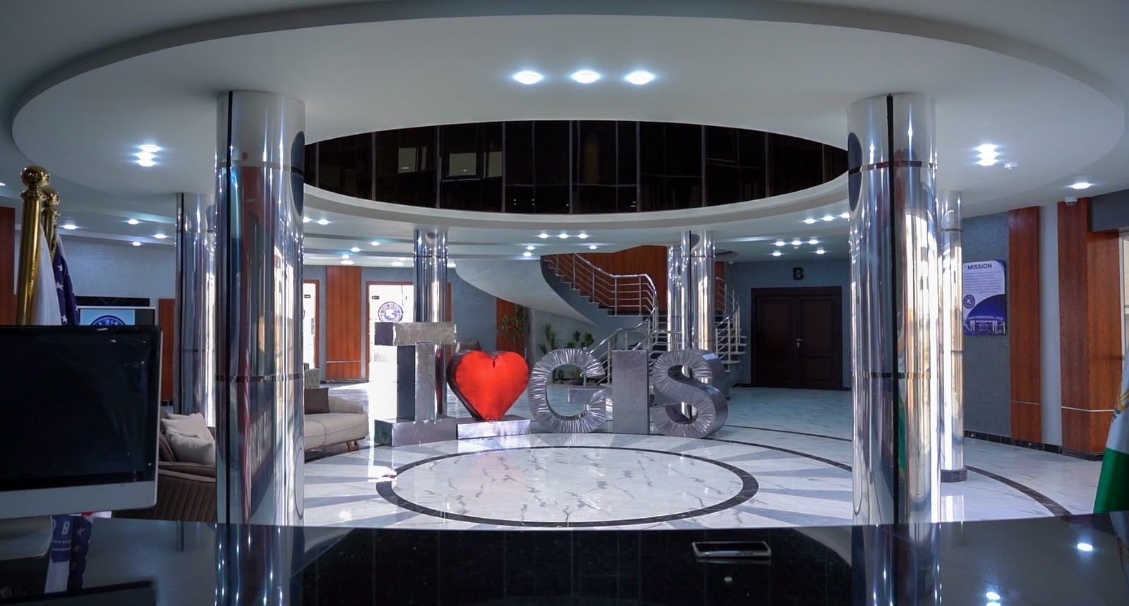 School reception with the I love GIS sign